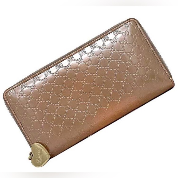 Gucci Handbags - Gucci Metallic Microguccissima Zip Around Heart Wallet Pink